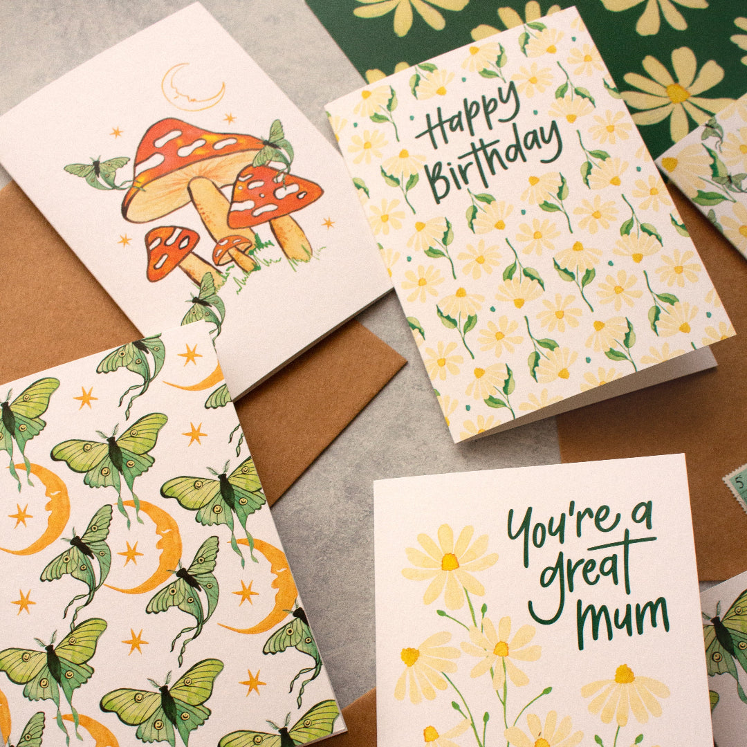Assorted botanical greeting cards showcasing vibrant floral patterns and nature-inspired artwork, printed on high-quality card stock.