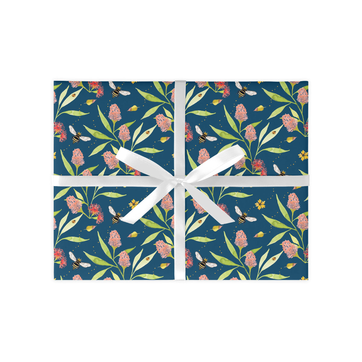 Gift box with floral pattern and white ribbon on a white background