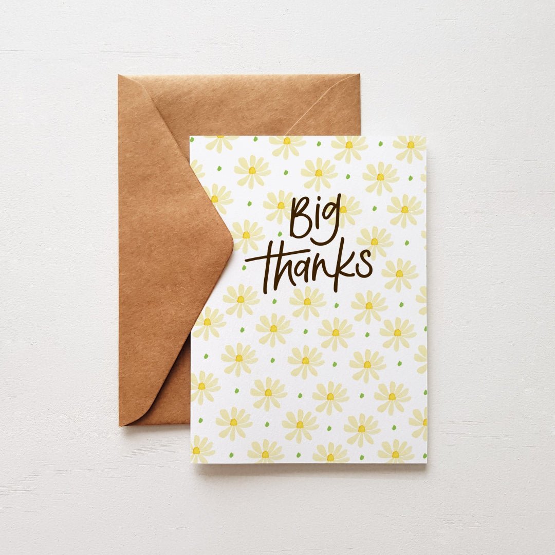 Thank you card with cream daisies, ‘Big Thanks’ in dark brown, kraft envelope, ideal for expressing gratitude.