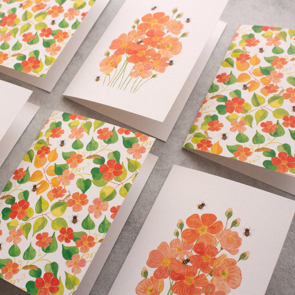 Set of floral greeting cards on a grey surface