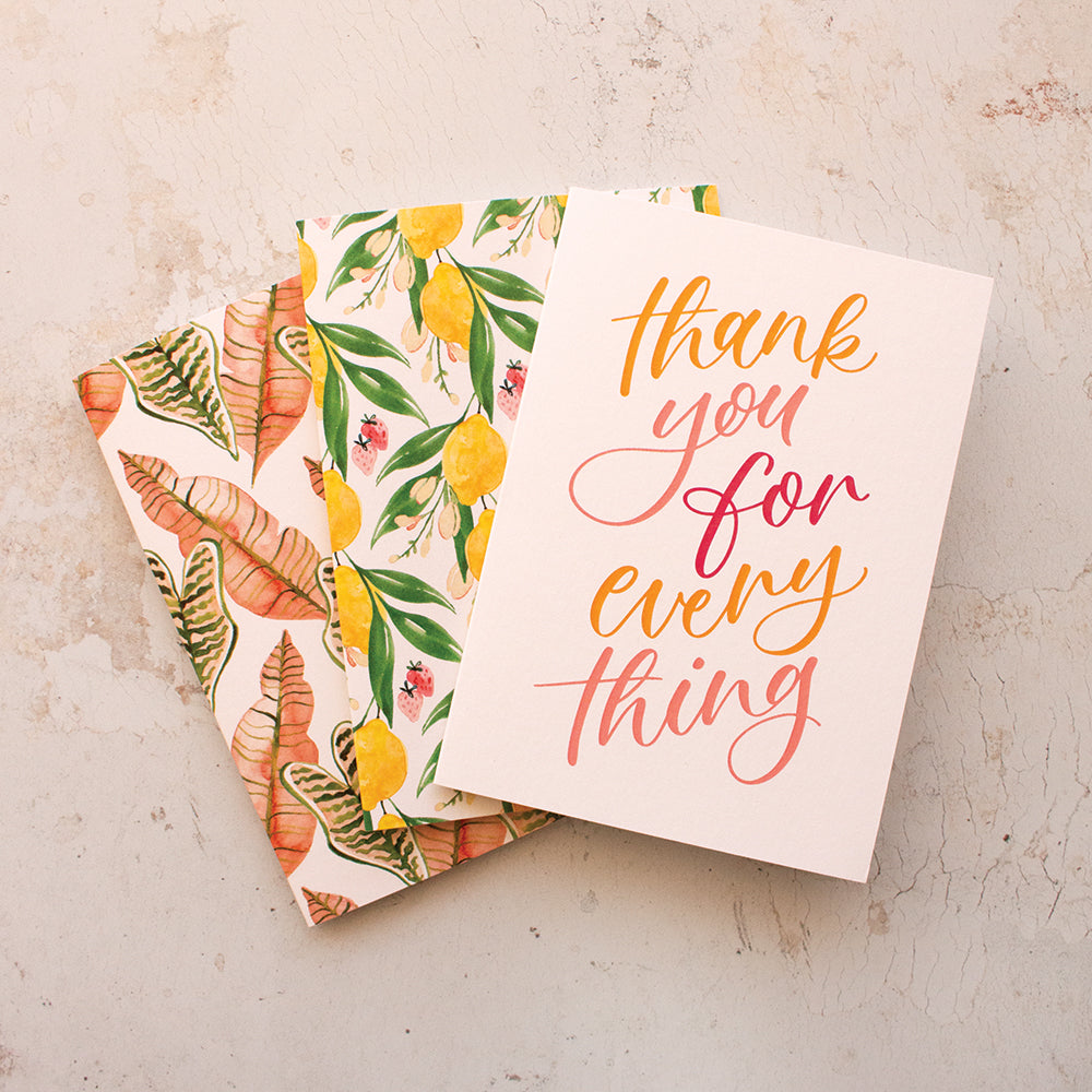 three greeting cards, a thank you card and two botanical greeting cards fanned out