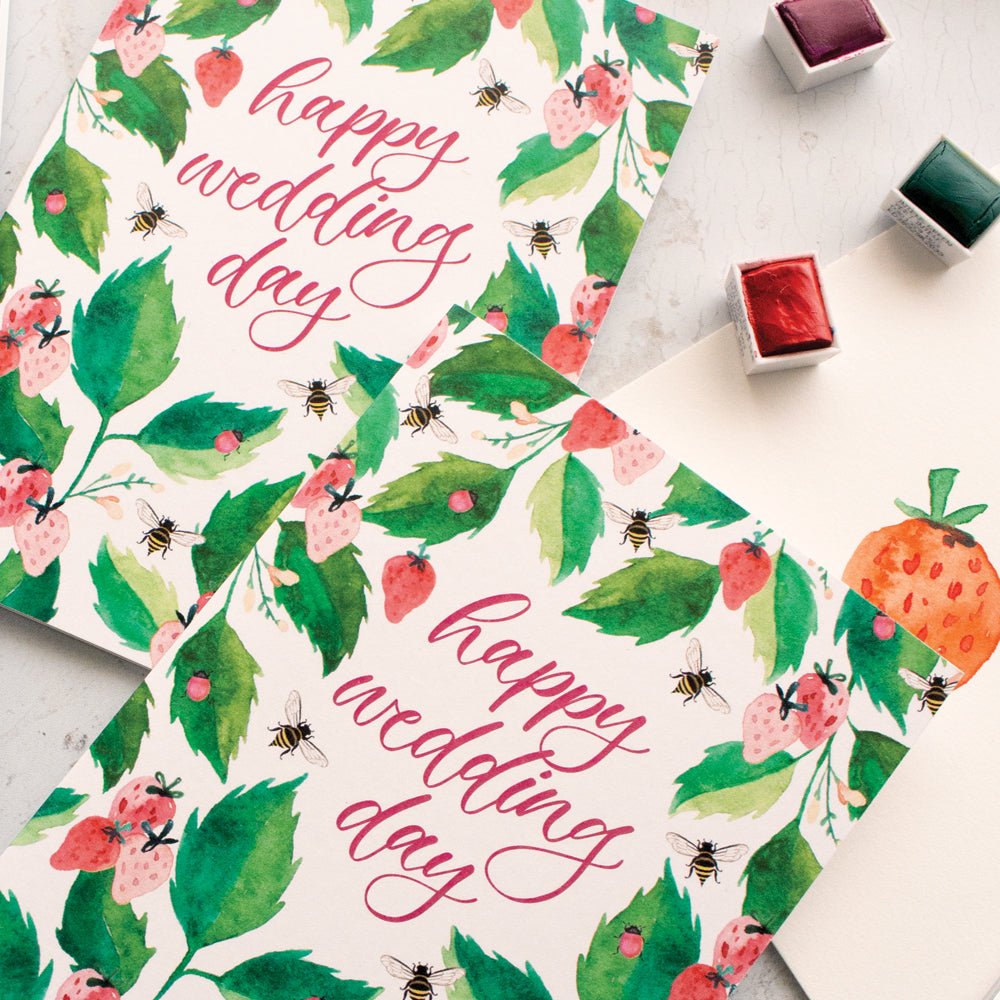 Floral design with 'happy wedding day' text on a white background