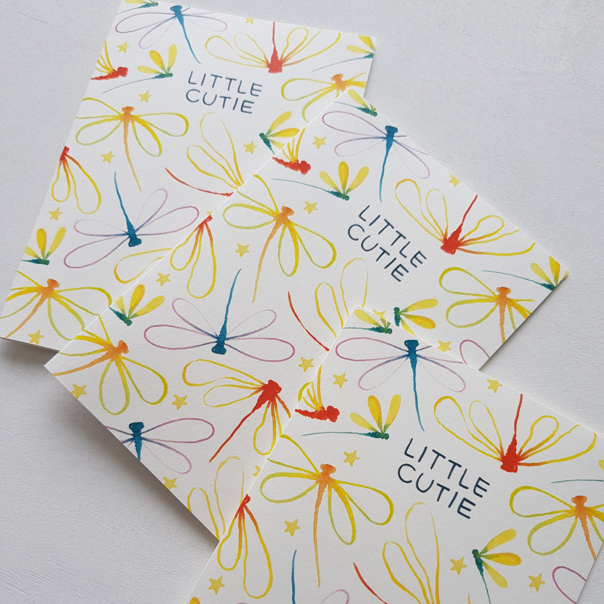 Rainbow dragonflies illustrations on baby greeting cards