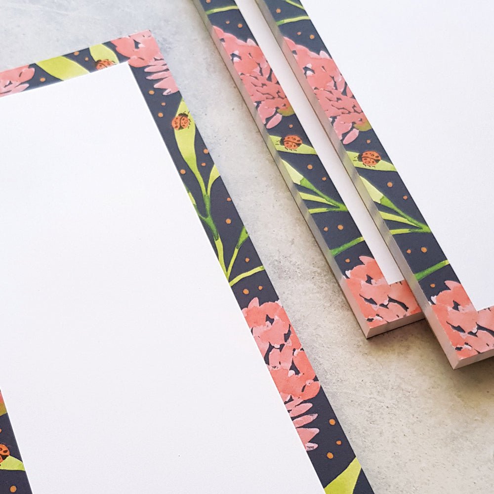close up of blank pink banksia notepads