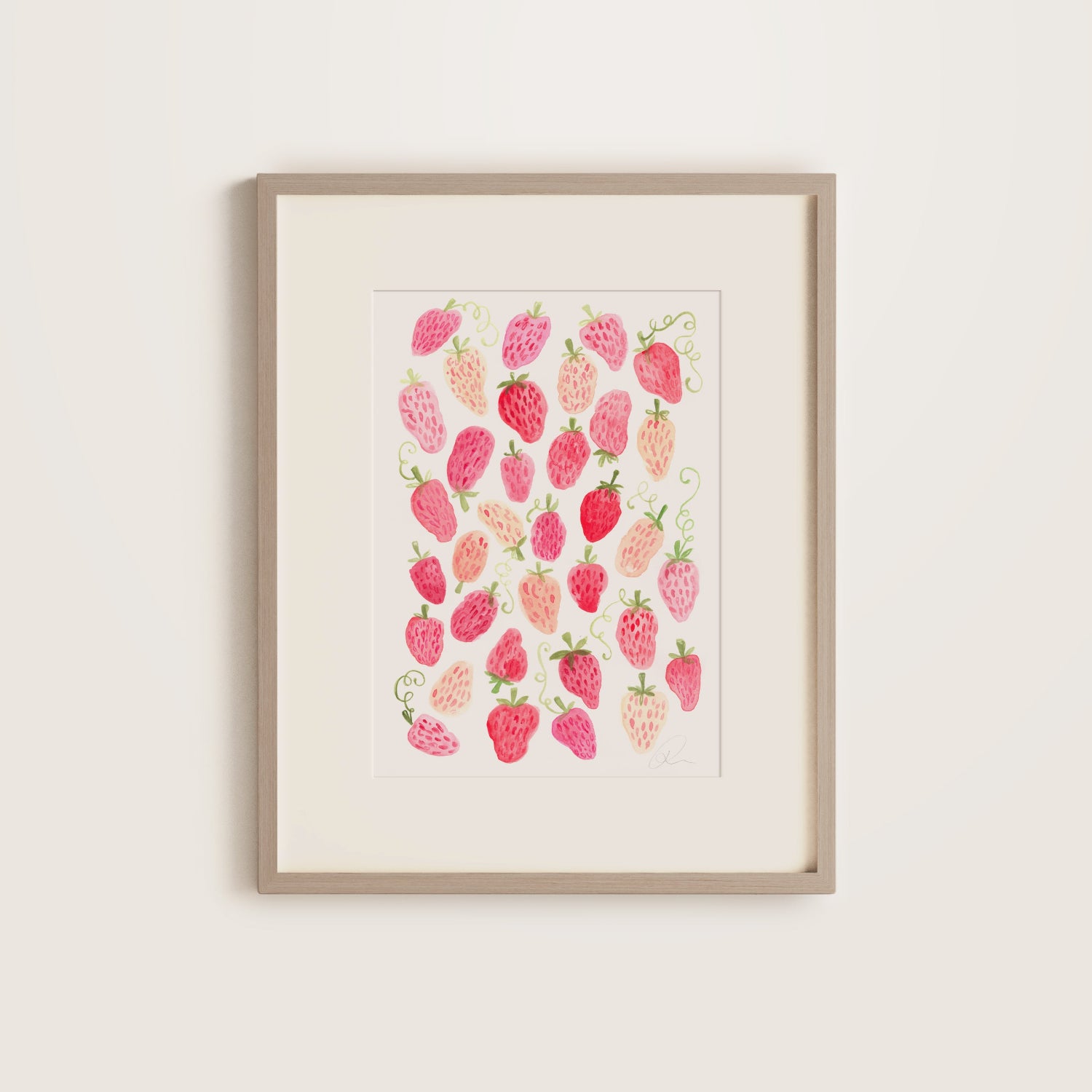 Framed artwork of pink and red strawberry pattern on a white background