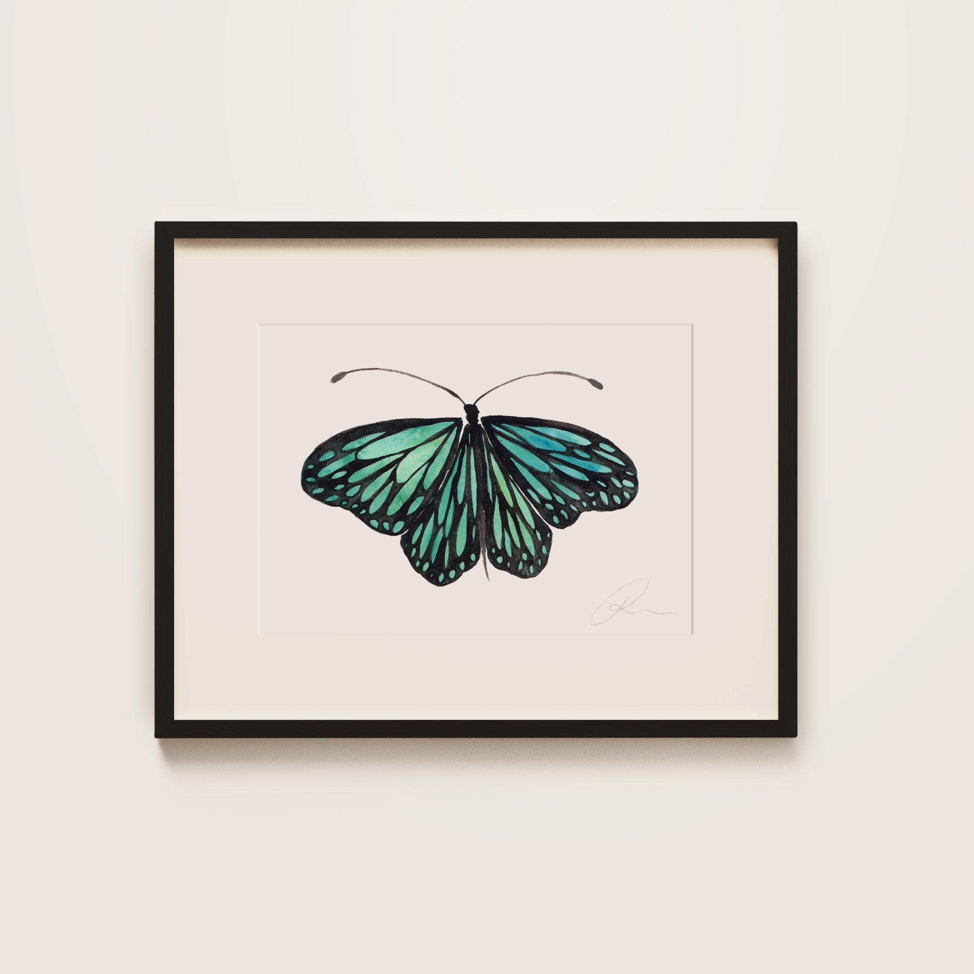 Framed artwork of a blue butterfly on a white background
