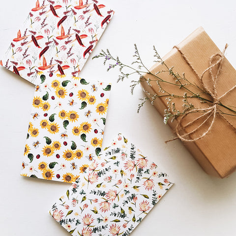 Botanical greeting cards with a wrapped present