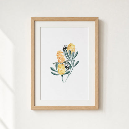 Framed artwork of a floral design on a white wall