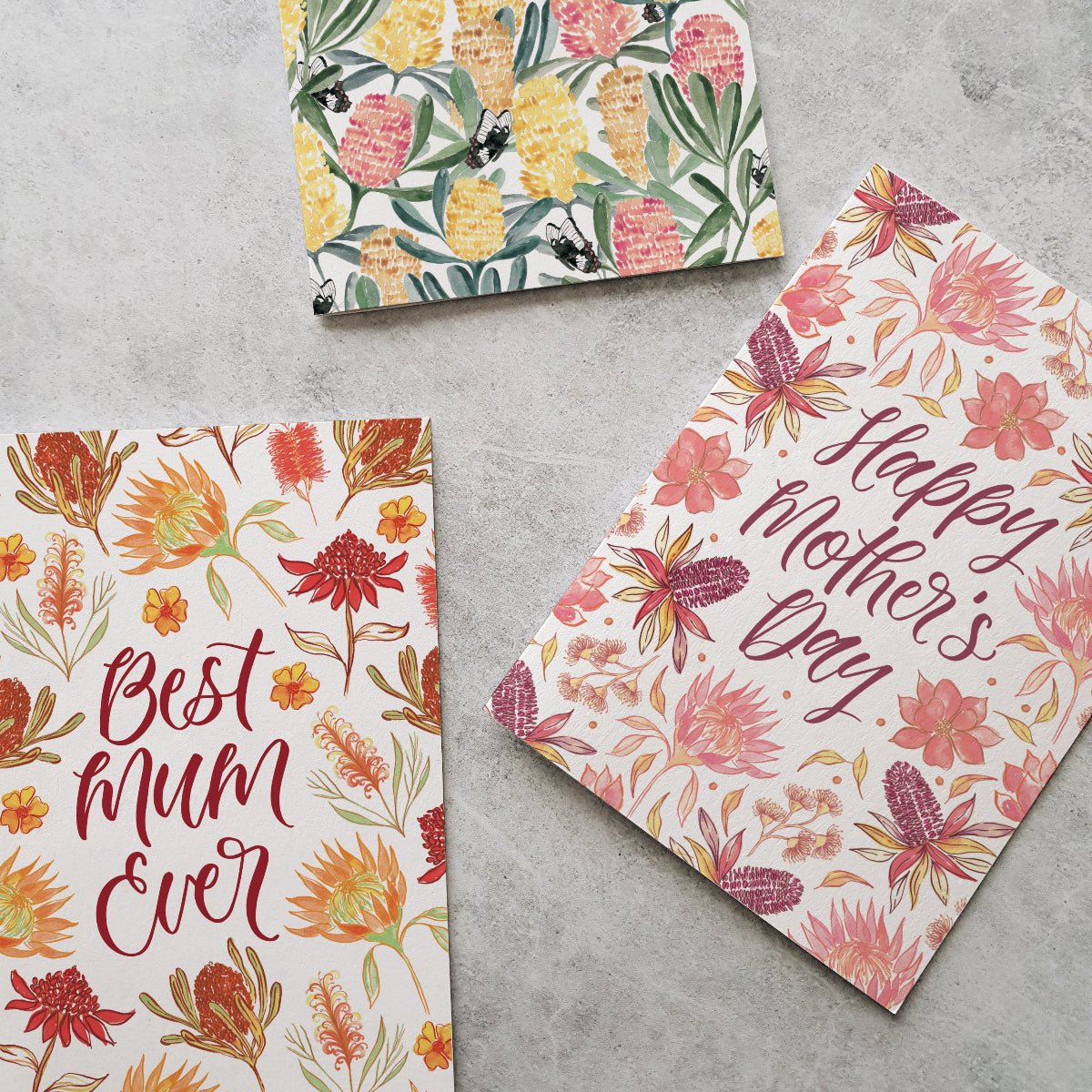 Colourful mother's day greeting cards with flower designs on a grey background