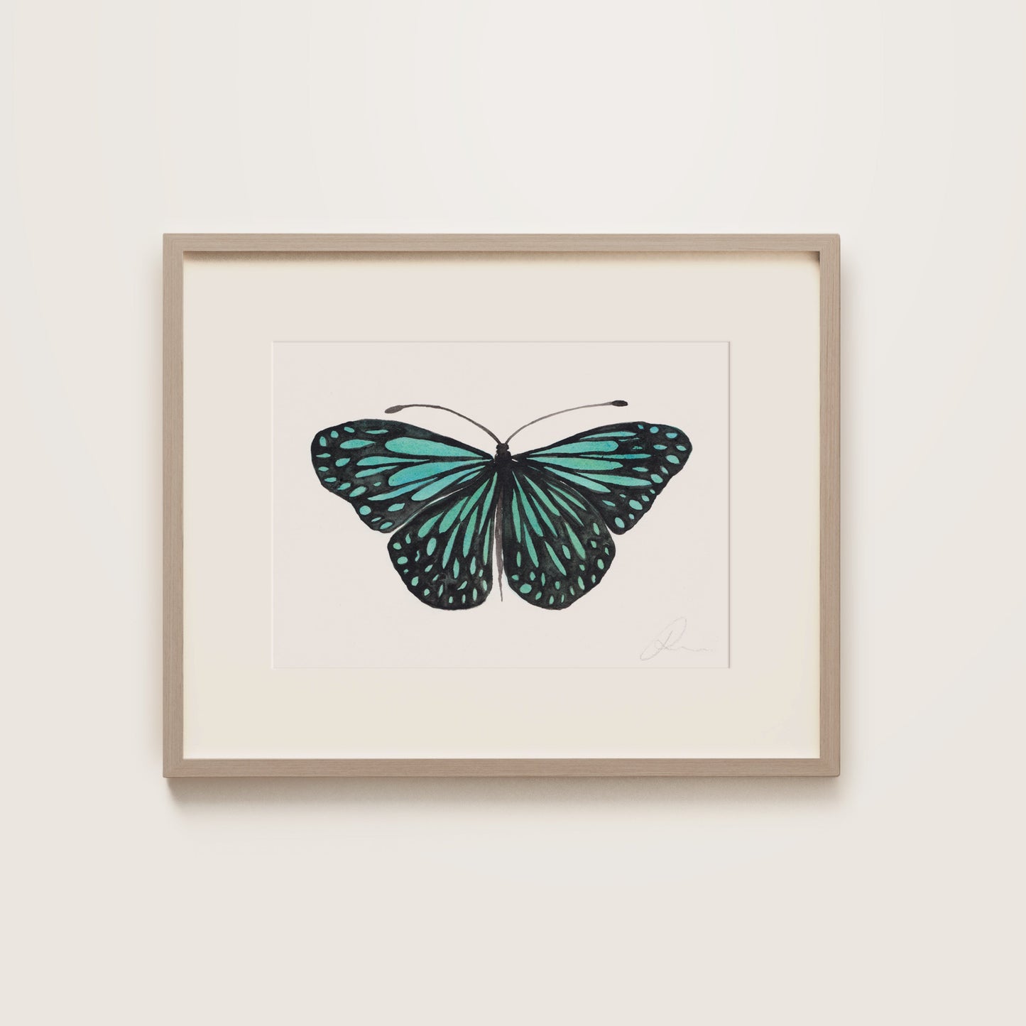 Framed artwork of a turquoise butterfly on a white background