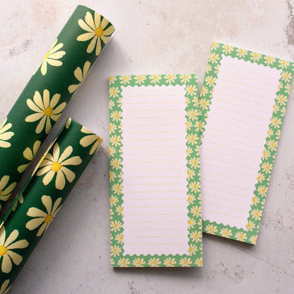 Teal DL notepads featuring daisies and lines, perfect for writing, with coordinating wrapping paper.