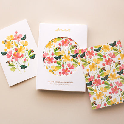 Handpainted botanical greeting cards with floral and butterfly illustrations