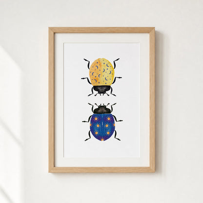 Framed artwork of two illustrated beetles on a white background