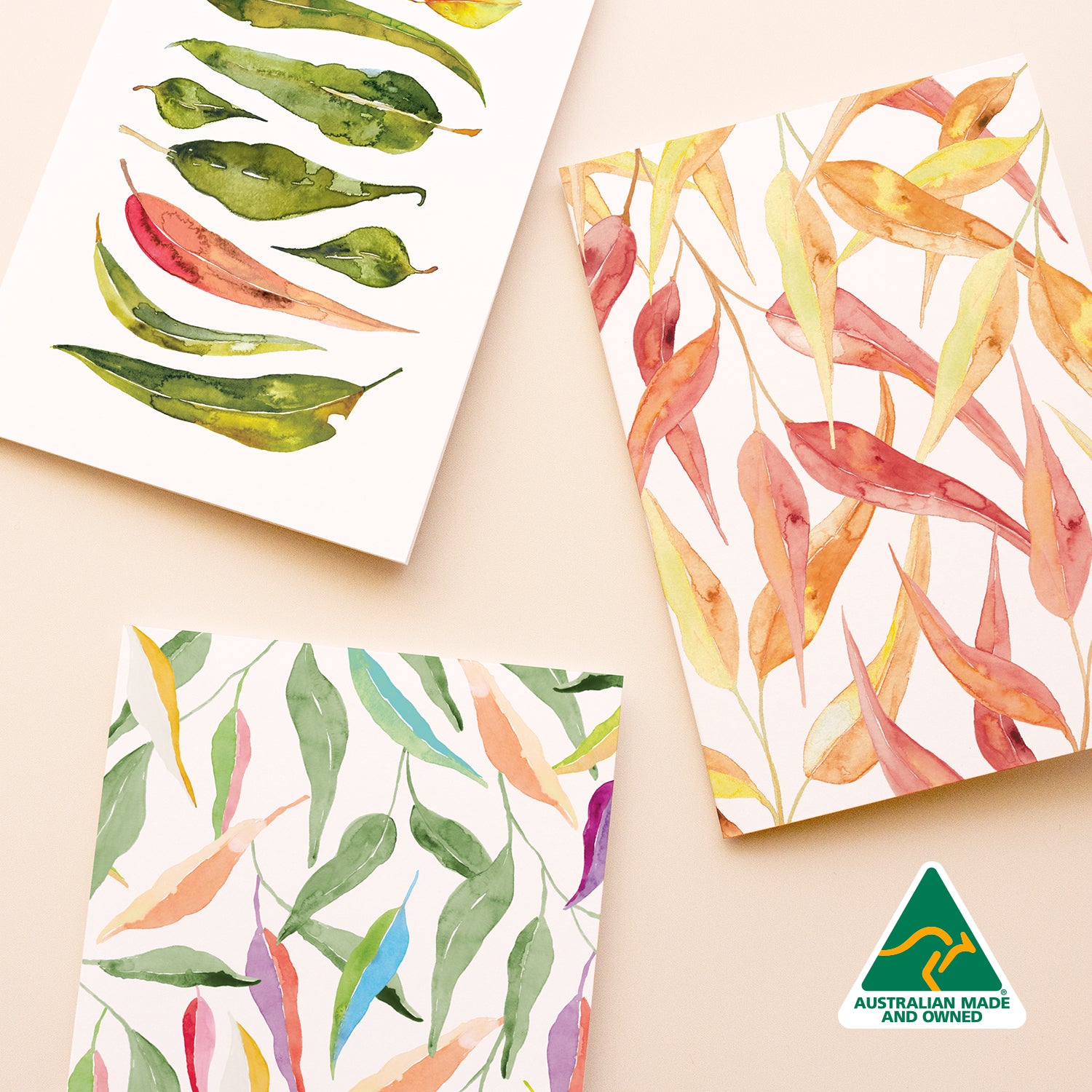 Three greeting cards with green, pink and colourful gum leaves