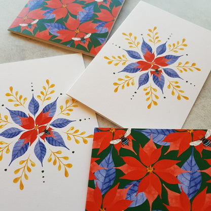 Four festive greeting cards with poinsettia and floral designs on a light background.