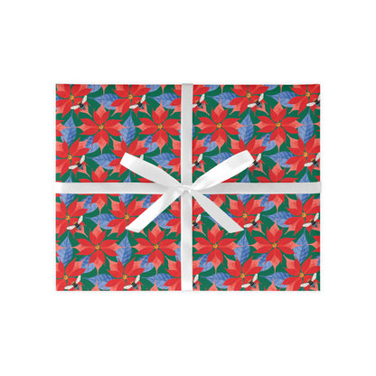 A colourful Poinsettia gift wrap sheet with a floral pattern, featuring a white ribbon for easy wrapping.