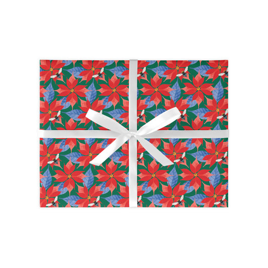 A colourful Poinsettia gift wrap sheet with a floral pattern, featuring a white ribbon for easy wrapping.