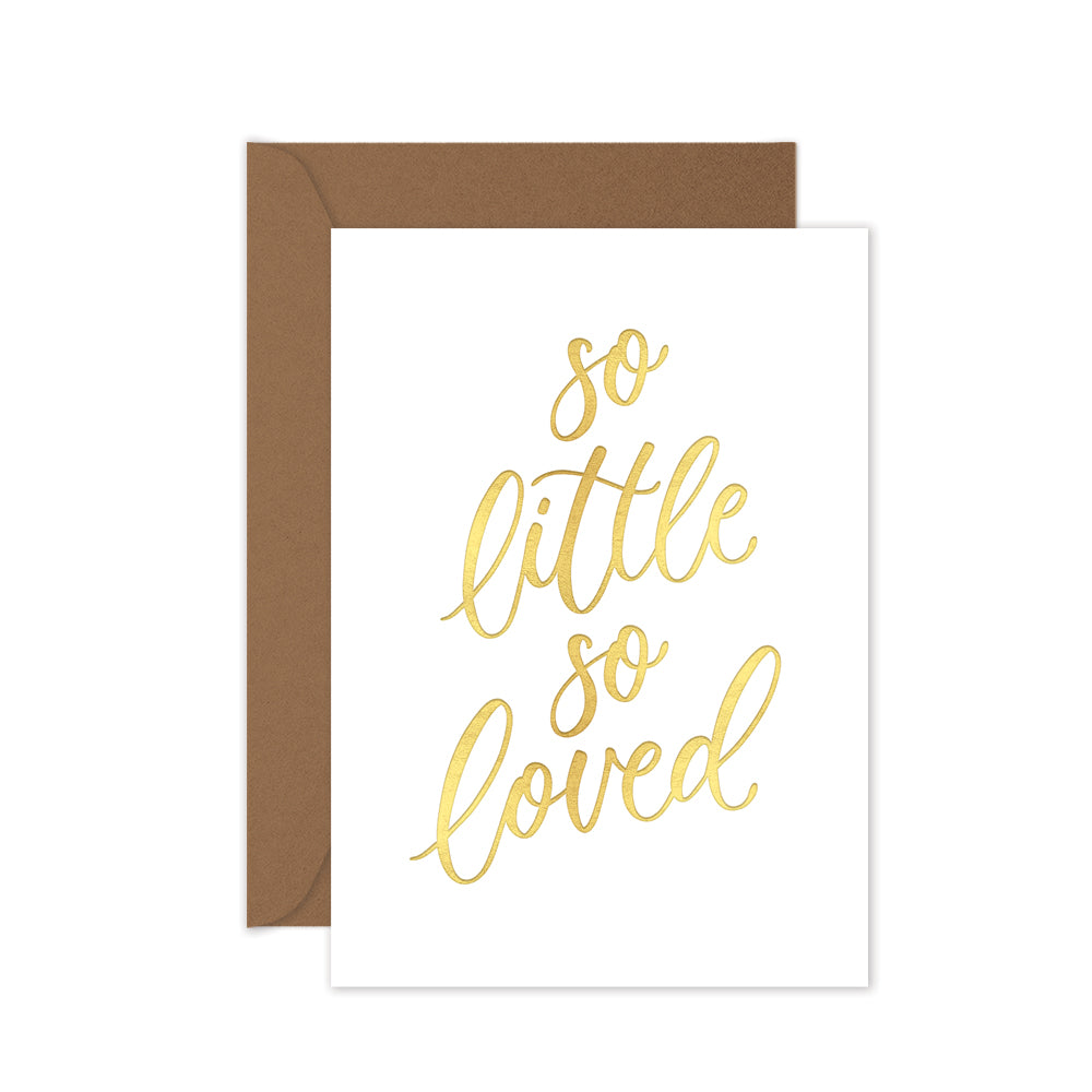 Greeting card with 'so little so loved' text in gold on a white background, with a brown envelope.
