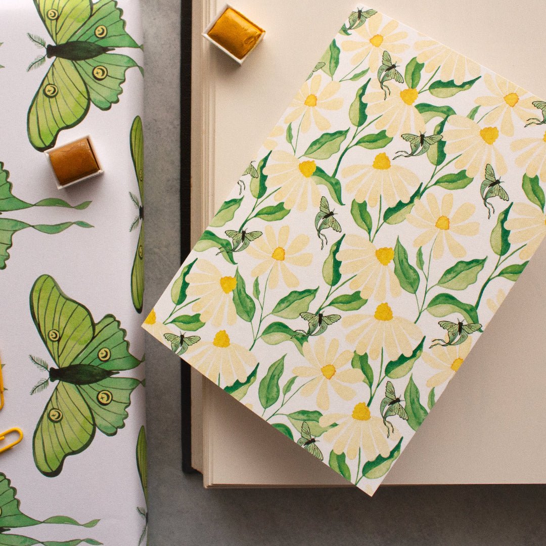 daisy flowers greeting card on a book