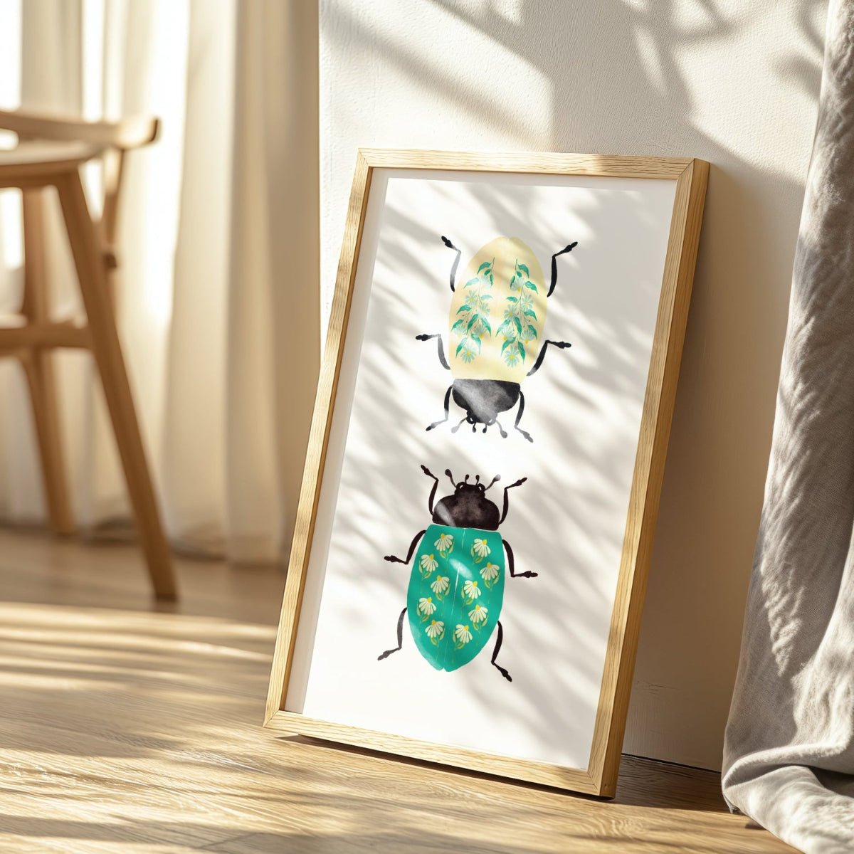 Framed artwork of beetles on a wooden surface with a light background