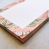 50 pages of pink and green jungle leaves lined DL notepad corner
