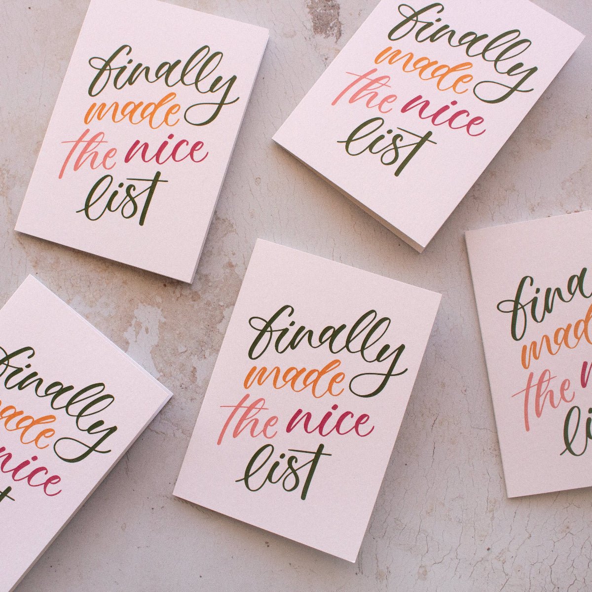 Five cards with 'Finally made the nice list' text on a textured surface