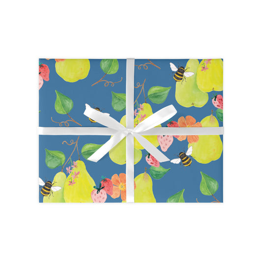present covered in a repeat pear pattern with bees. The present is tied with a white ribbon in a bow