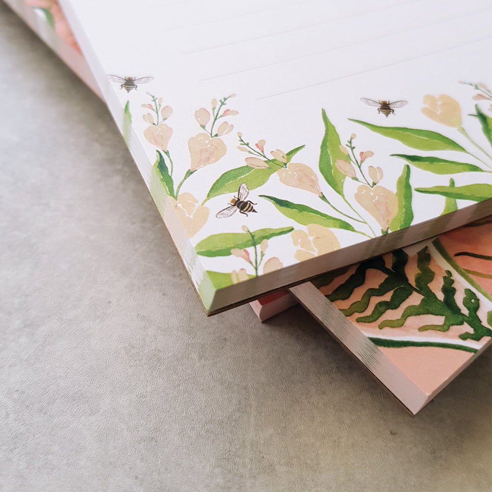 close up of freesias and bumble bee dl notepad design