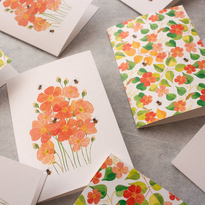 Floral patterned cards on a grey surface