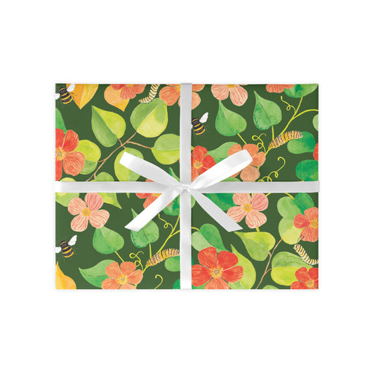 Gift box with floral pattern and white ribbon on a white background