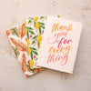 three greeting cards, a thank you card and two botanical greeting cards fanned out