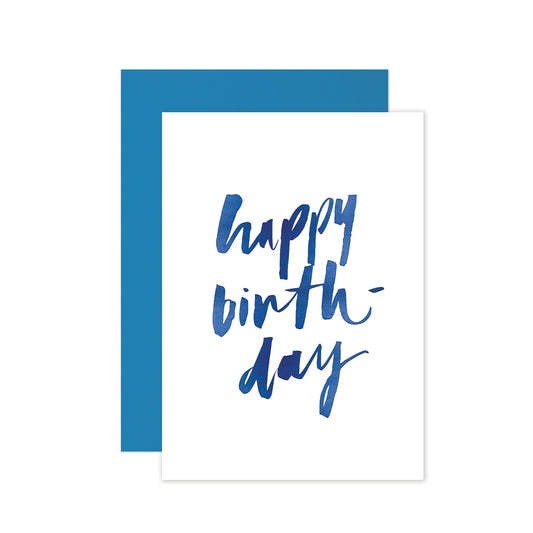 Hand-lettered happy birthday greeting card with navy blue foil details and a matching blue envelope