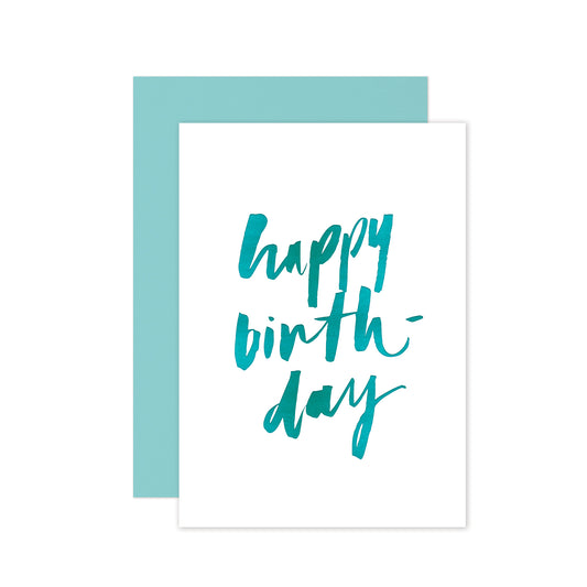 Hand-lettered happy birthday card with teal foil accents and a matching teal envelope, perfect for a fresh and stylish celebration.