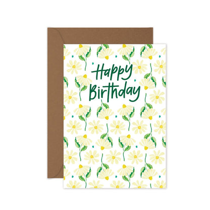 Happy Birthday greeting card with repeat daisy pattern and kraft envelope.