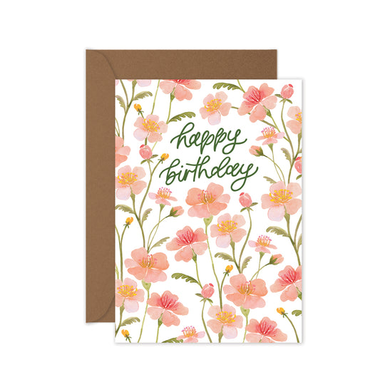 Floral birthday card with 'Happy Birthday' text and brown envelope on white background