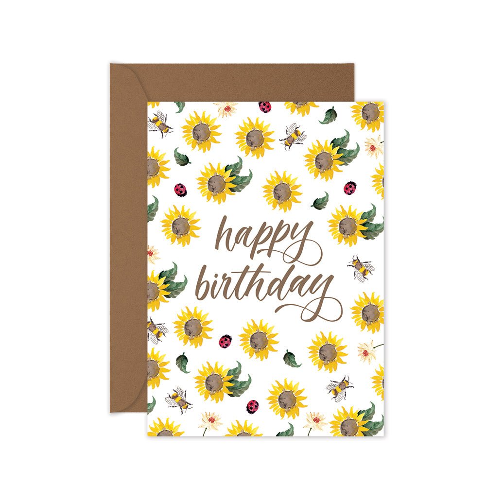 Happy birthday greeting card with yellow sunflowers, lady beetles and bees on a brown envelope