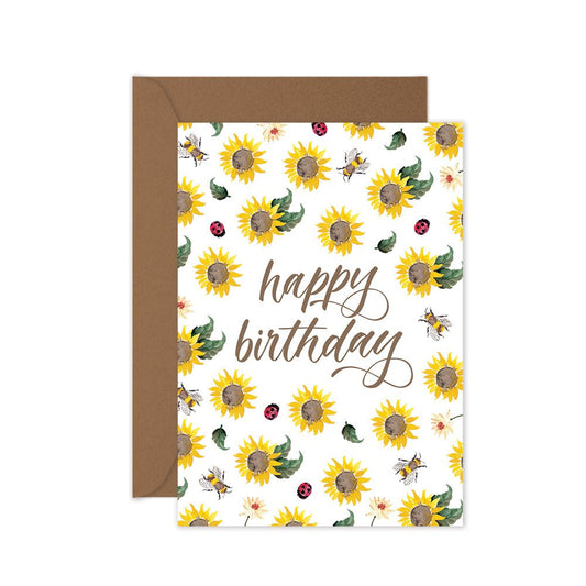 Happy birthday greeting card with yellow sunflowers, lady beetles and bees on a brown envelope