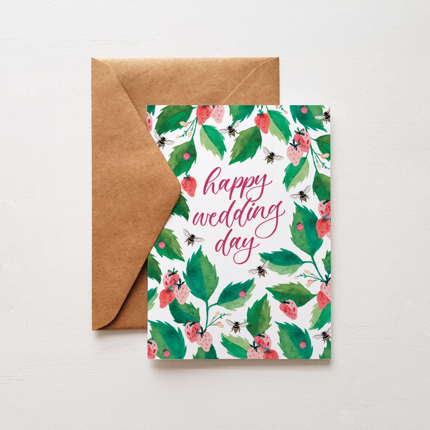 Floral card with 'happy wedding day' text and brown envelope on white background