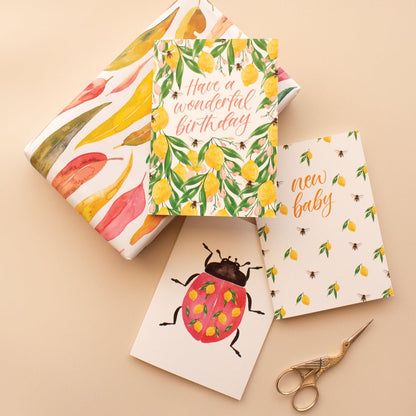 pink green yellow gum leaves wrapping paper and lemon birthday and baby lady bug greeting cards