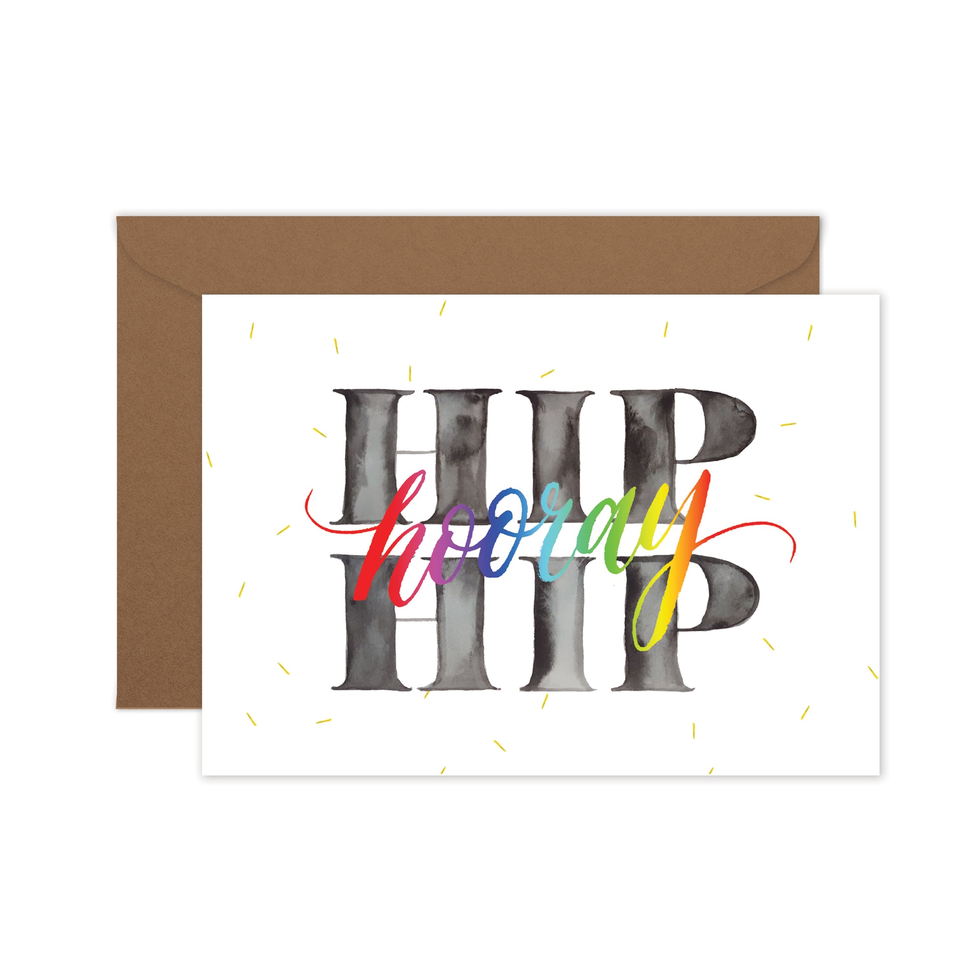 Birthday card 'HIP HIP Hooray' written in chunky letters in grey tones, with rainbow script and yellow confetti sprinkles, on a brown envelope