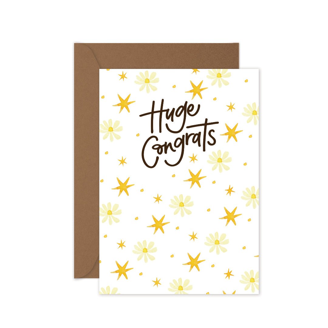 Huge Congrats greeting card featuring delicate daisies and yellow stars, paired with a kraft envelope.