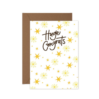 Huge Congrats greeting card featuring delicate daisies and yellow stars, paired with a kraft envelope.