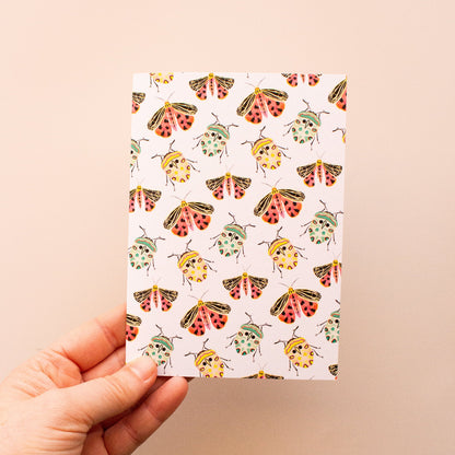 Everyday botanical art greeting card featuring beetles and moths