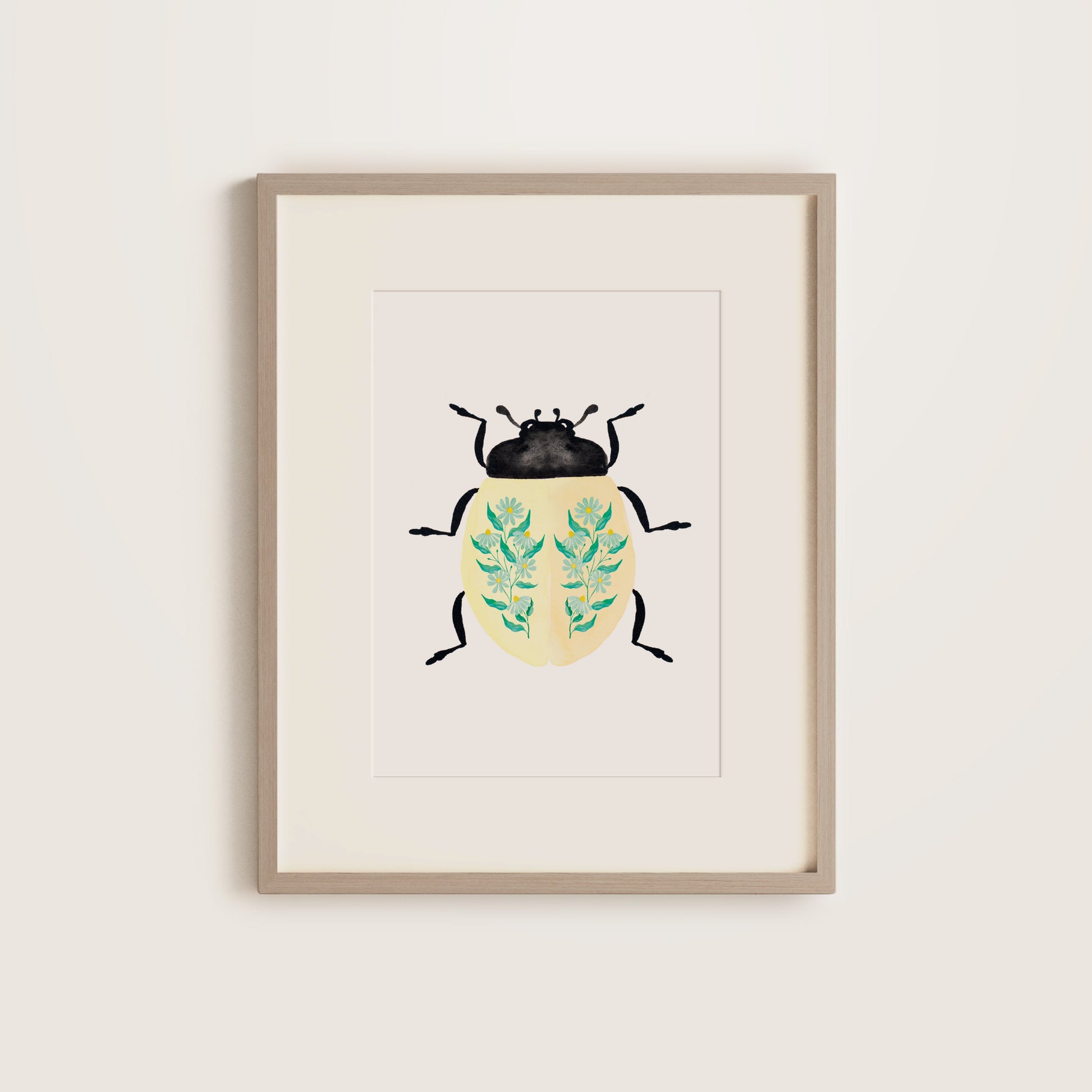 Cream lady beetle art print with teal daisies on its back, framed botanical illustration