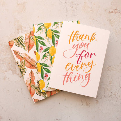 three greeting cards, a thank you card and two botanical greeting cards fanned out