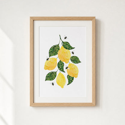 Framed artwork of lemons and leaves on a white background