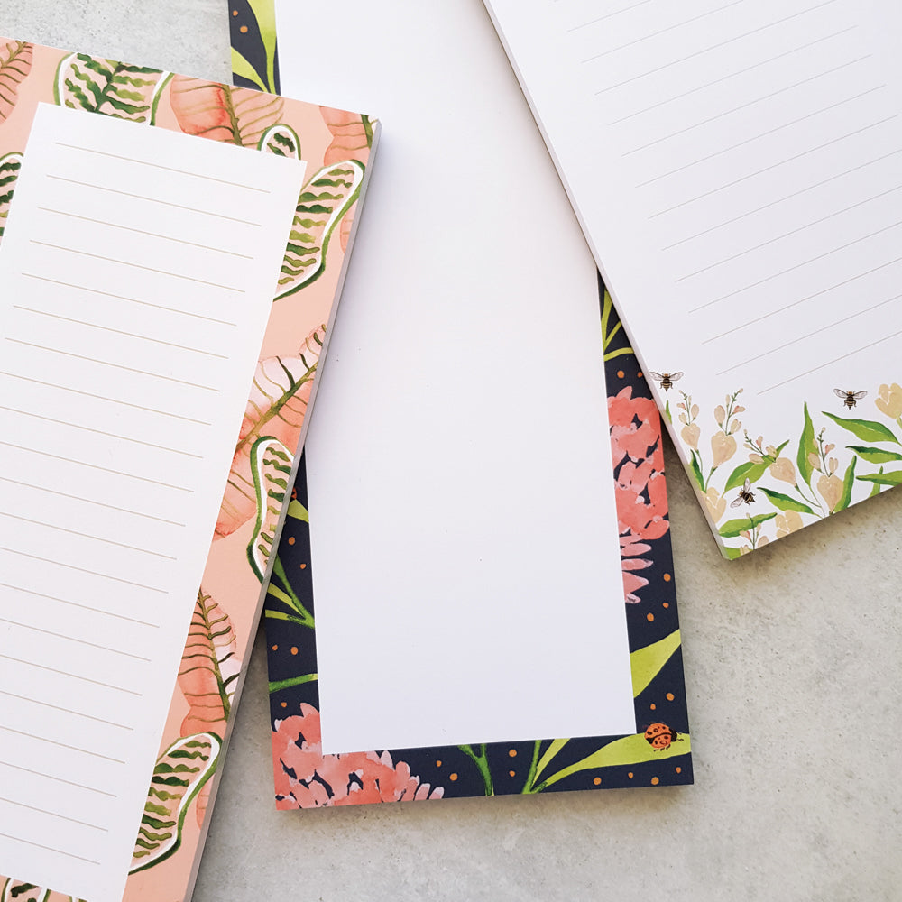 lined and blank DL notepads in pink and green botanical illustrations