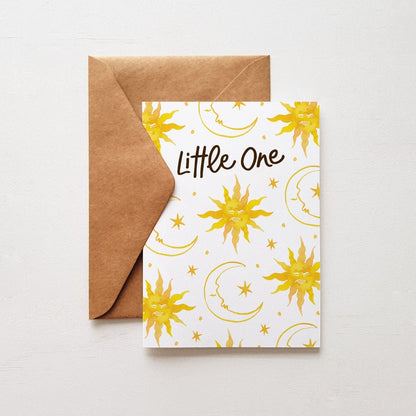 Baby greeting card with 'Little One' message and a celestial design featuring suns, moons, and stars, ideal for newborn celebrations with kraft envelope.