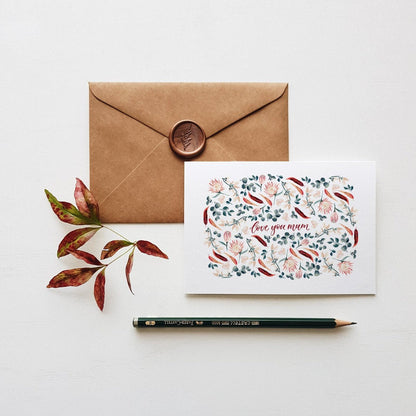 floral mum greeting card with brown envelope, wax seal, pencil and leaves