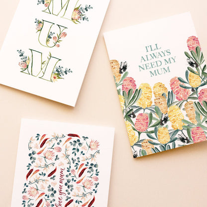 Three colourful floral mother's day greeting cards on a beige background